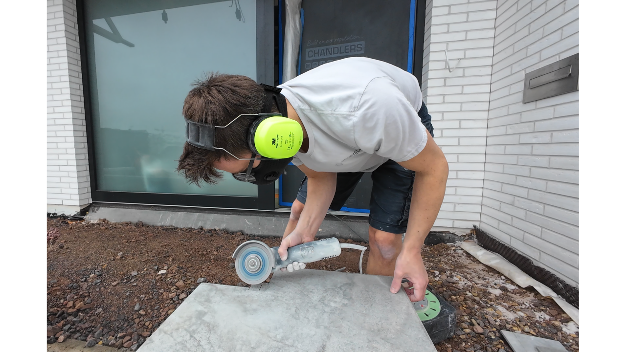 Alec cutting a tile on site